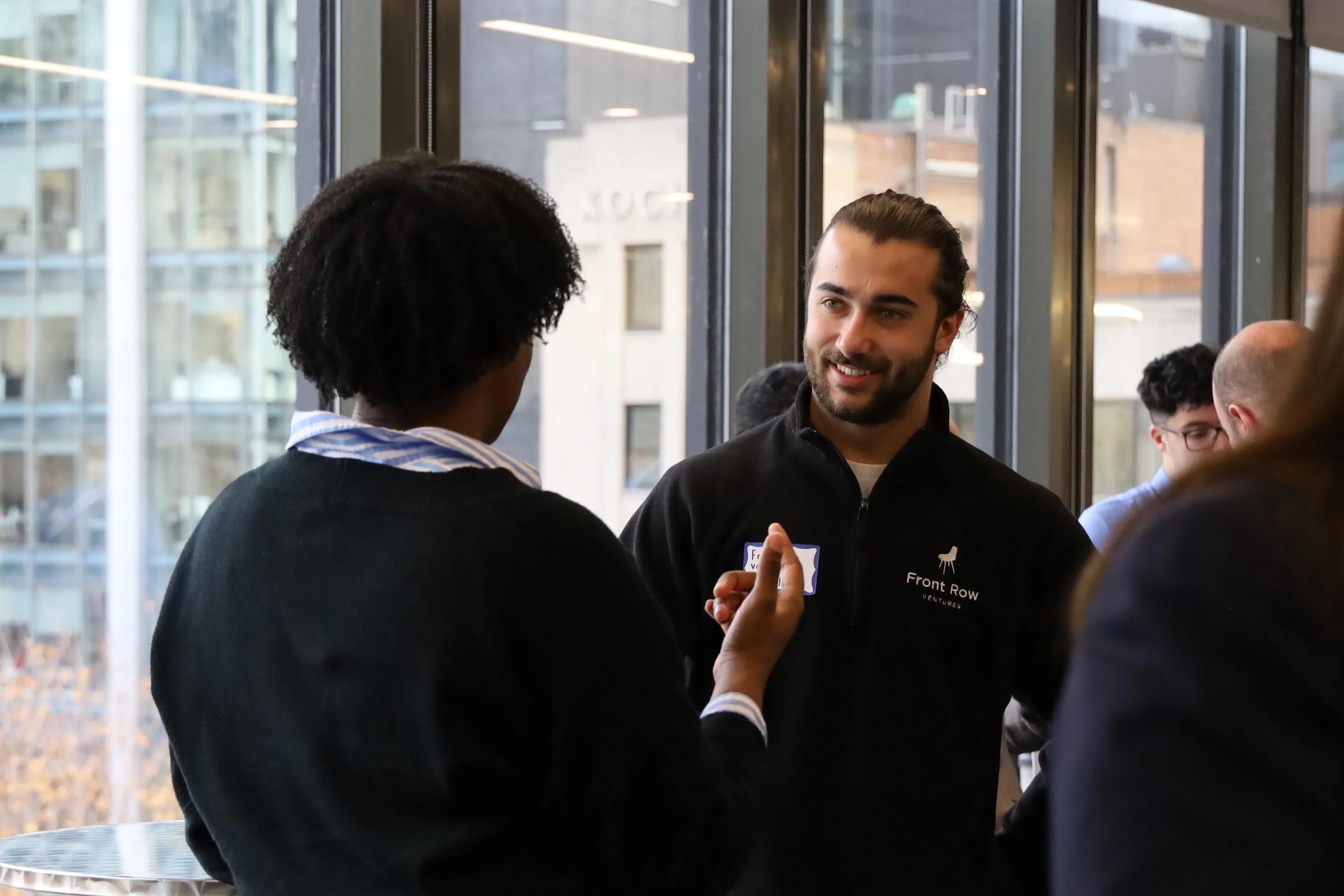 Nicolas Dolgopolyy in conversation with attendees at an FRV event